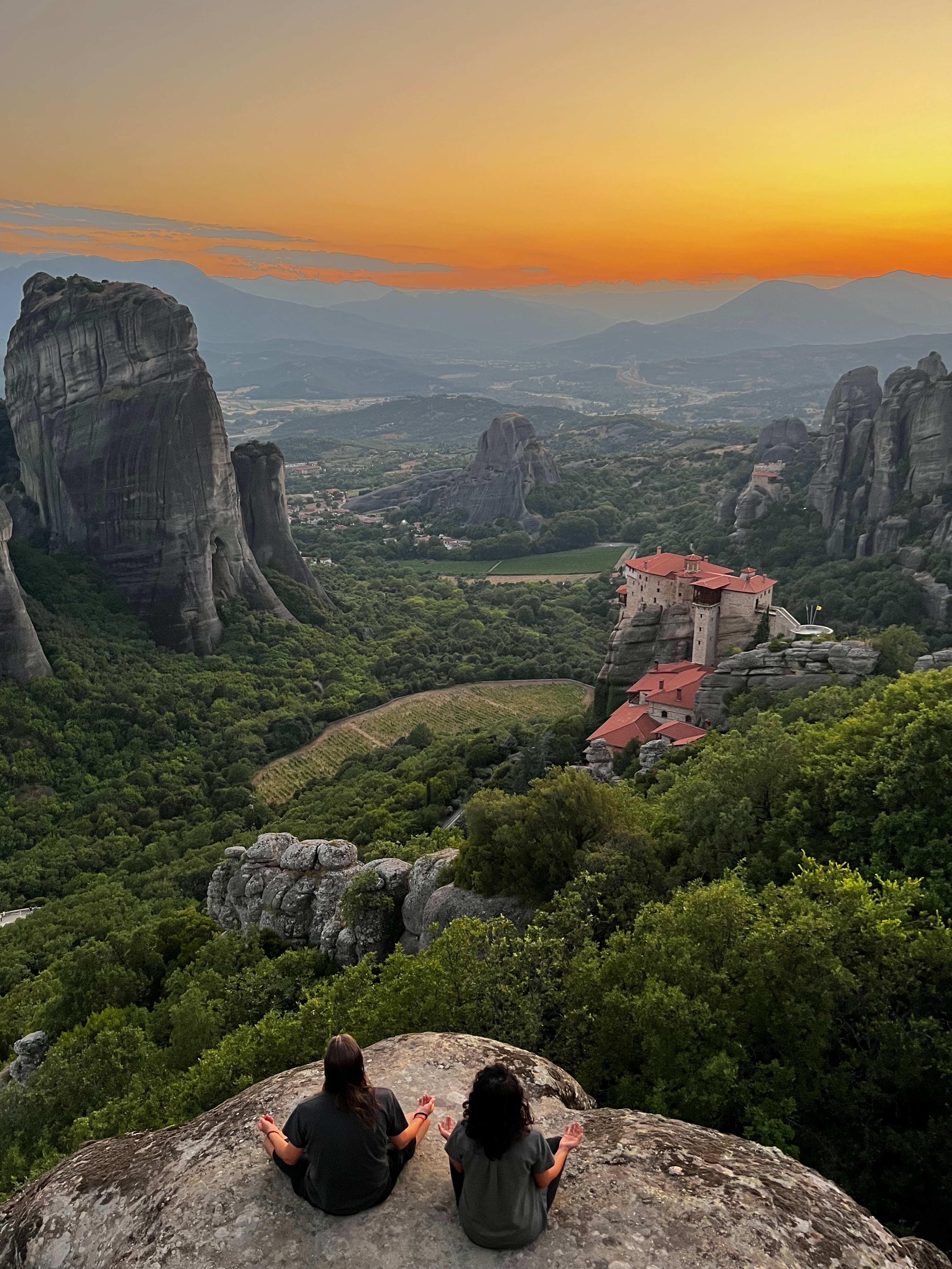 Sam and Tulsi meditating at Meteora