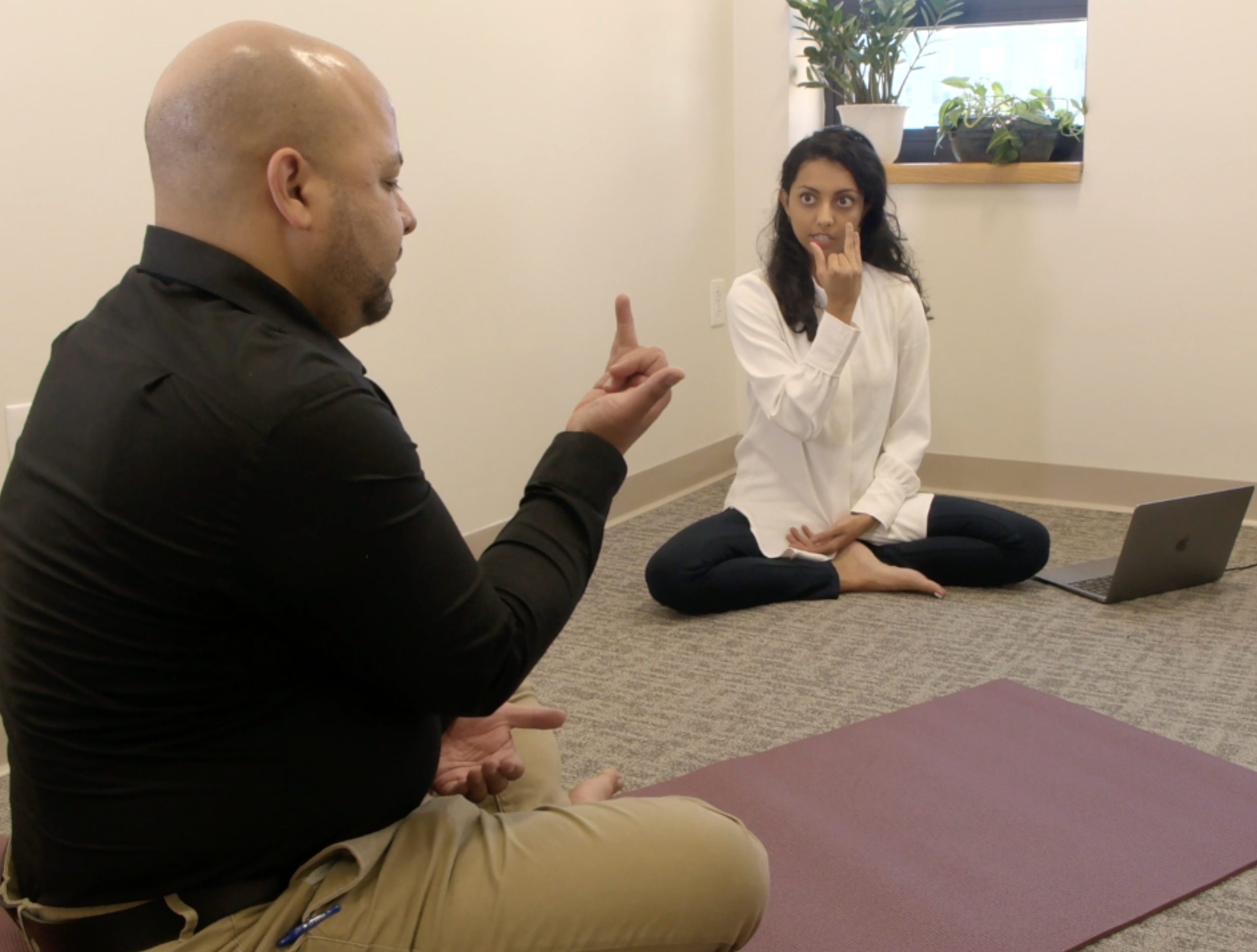 Tulsi working with a client